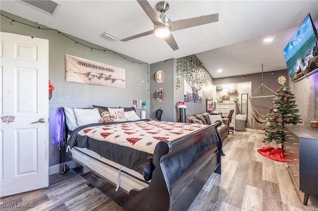 bedroom with hardwood / wood-style floors and ceiling fan