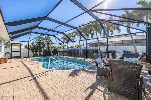 view of pool featuring a lanai and a patio