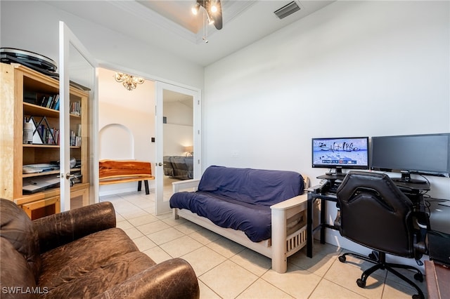 home office with french doors, ceiling fan, a raised ceiling, and light tile patterned floors