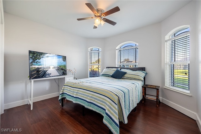 bedroom featuring dark wood-type flooring and ceiling fan