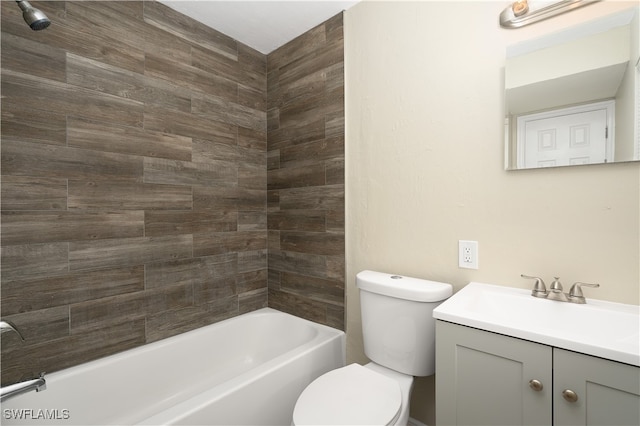 full bathroom with vanity, toilet, and tiled shower / bath