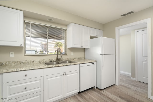 kitchen featuring white cabinets, white appliances, sink, and light hardwood / wood-style flooring