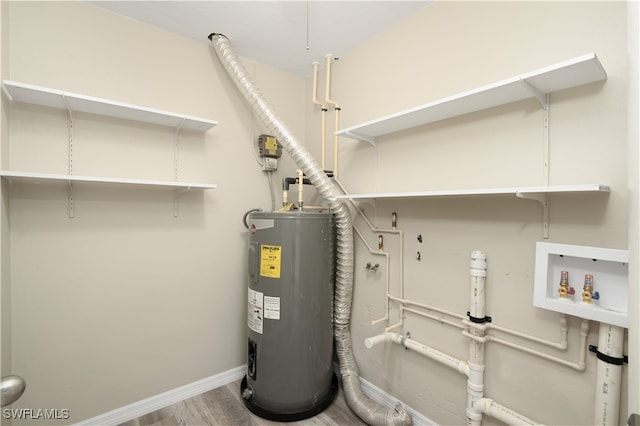 utility room featuring electric water heater