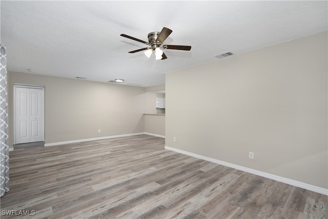 unfurnished room featuring ceiling fan and light hardwood / wood-style flooring