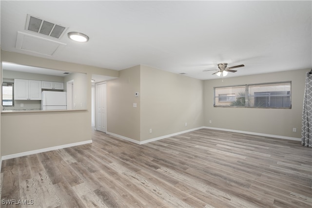 unfurnished room featuring light hardwood / wood-style flooring and ceiling fan