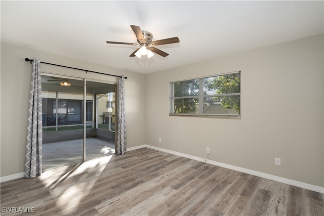 spare room featuring ceiling fan and wood-type flooring