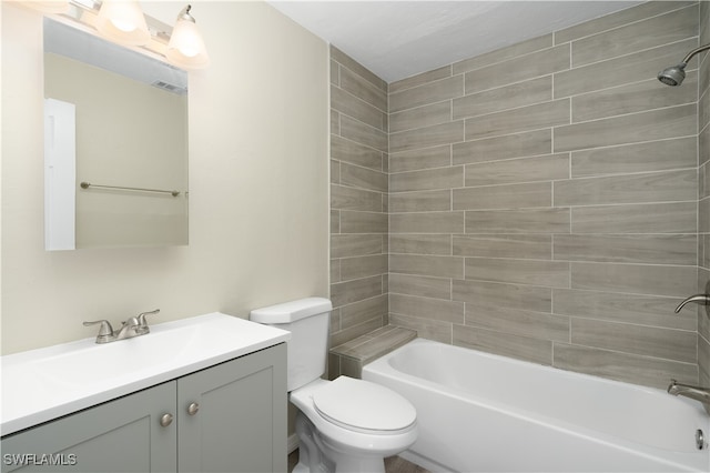 full bathroom featuring vanity, toilet, and tiled shower / bath