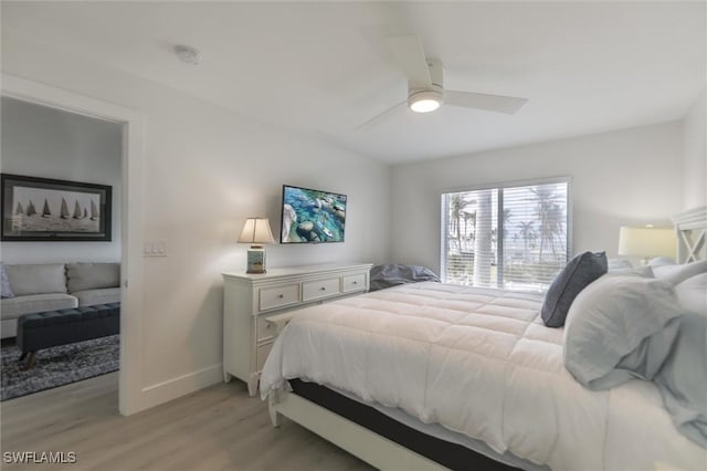 bedroom featuring light wood-type flooring and ceiling fan