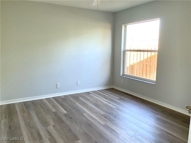 spare room with hardwood / wood-style floors