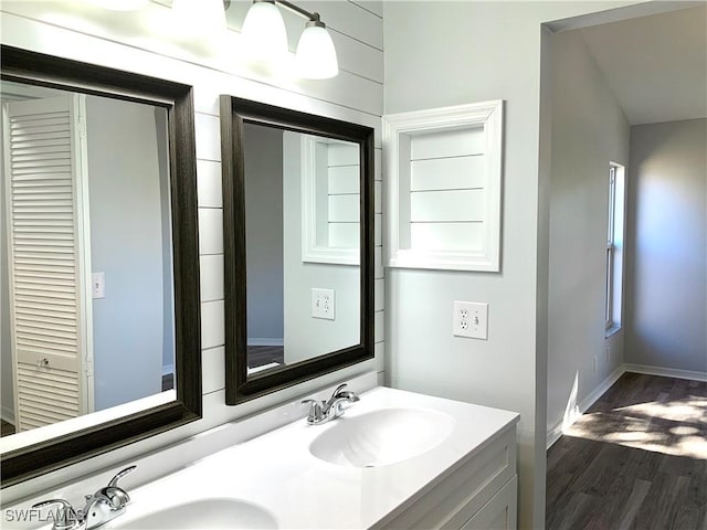 bathroom featuring hardwood / wood-style floors and vanity