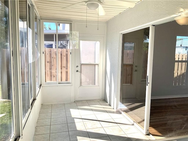 unfurnished sunroom with plenty of natural light