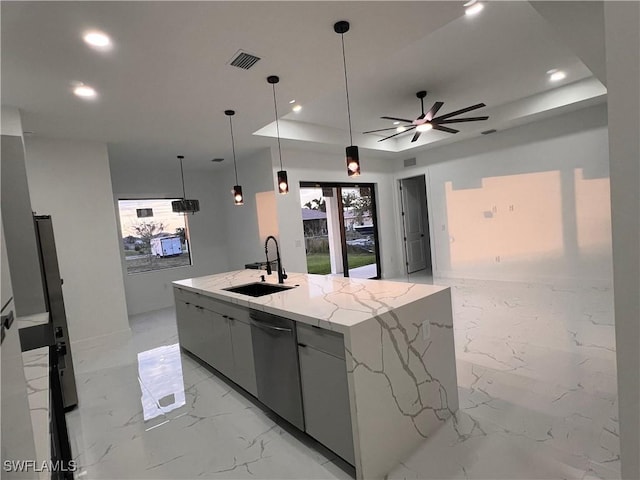 kitchen featuring dishwasher, a spacious island, sink, decorative light fixtures, and light stone counters