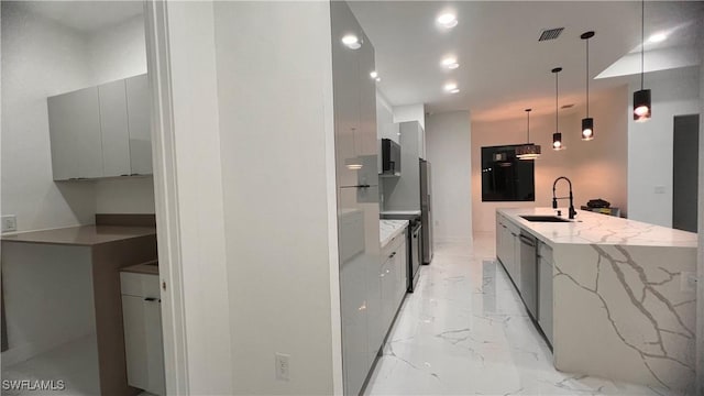 kitchen featuring white cabinetry, light stone countertops, sink, hanging light fixtures, and electric stove