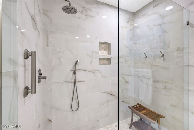 bathroom featuring tiled shower