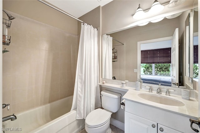 full bathroom featuring vanity, shower / tub combo, and toilet