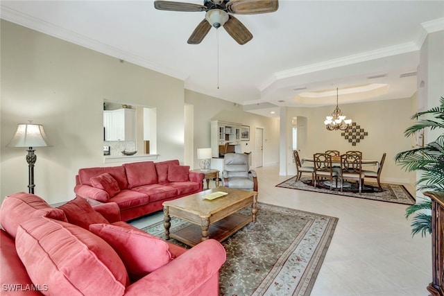 tiled living room featuring ceiling fan with notable chandelier, a raised ceiling, and ornamental molding