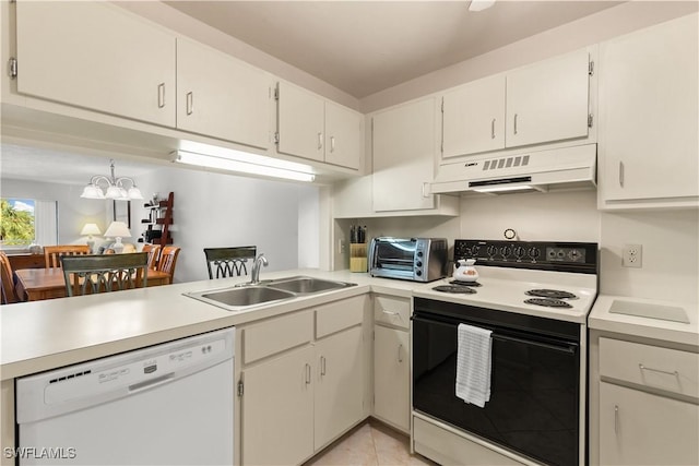 kitchen featuring kitchen peninsula, white appliances, sink, white cabinetry, and light tile patterned flooring