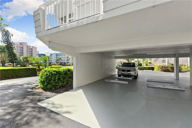 view of parking / parking lot with a carport