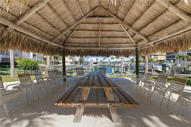 surrounding community featuring a gazebo and a water view