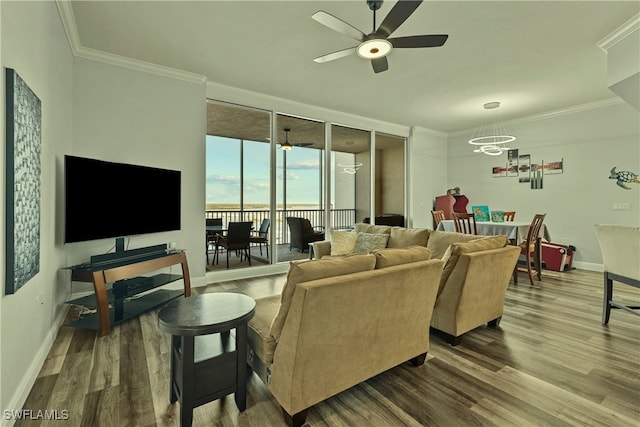 living room featuring hardwood / wood-style floors, a notable chandelier, and ornamental molding