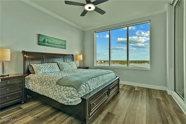 bedroom with ceiling fan, wood-type flooring, and crown molding