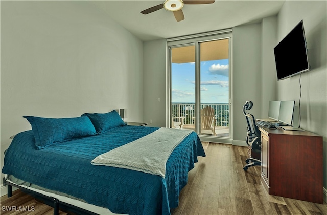 bedroom featuring wood-type flooring, access to outside, and ceiling fan