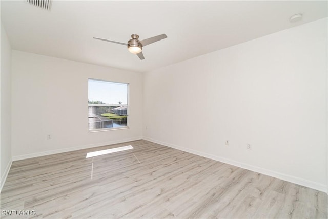 unfurnished room featuring ceiling fan and light hardwood / wood-style flooring