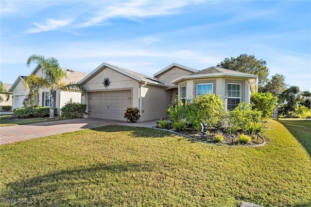 ranch-style house featuring a front yard and a garage