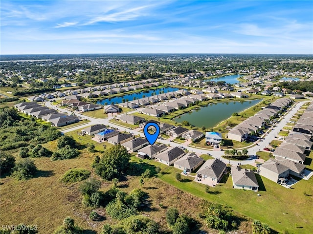 birds eye view of property featuring a water view