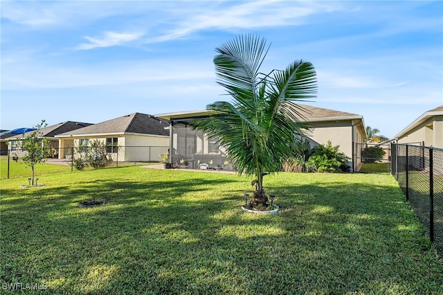 view of yard featuring a sunroom