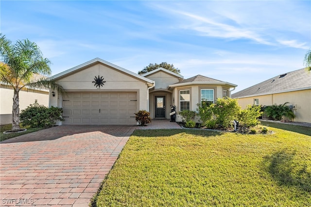 ranch-style house featuring a garage and a front yard