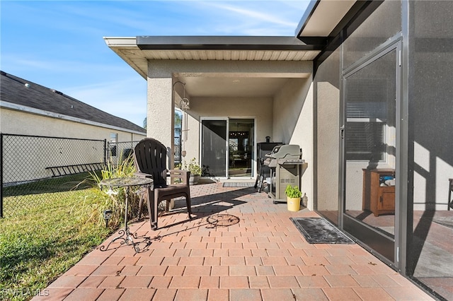 view of patio featuring a grill