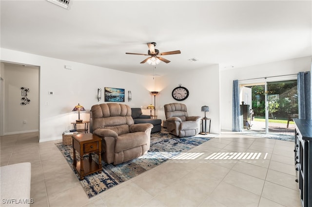 tiled living room featuring ceiling fan