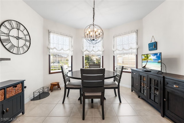 dining space featuring plenty of natural light, light tile patterned floors, and a chandelier