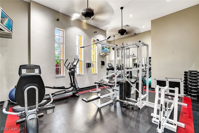 exercise room with visible vents and recessed lighting