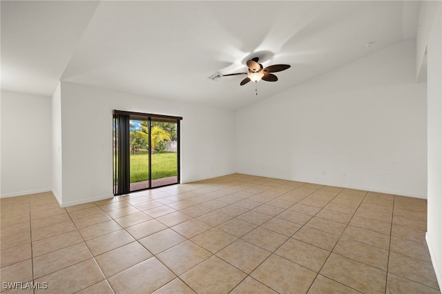 tiled spare room with ceiling fan and lofted ceiling