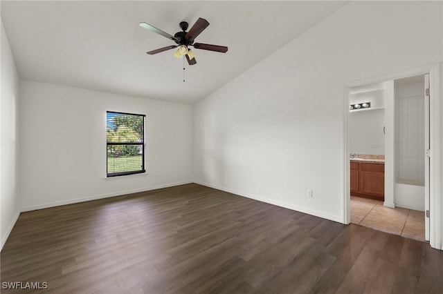 unfurnished room with ceiling fan, dark hardwood / wood-style flooring, and lofted ceiling