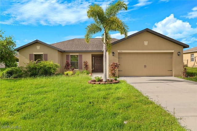 single story home with a front yard and a garage