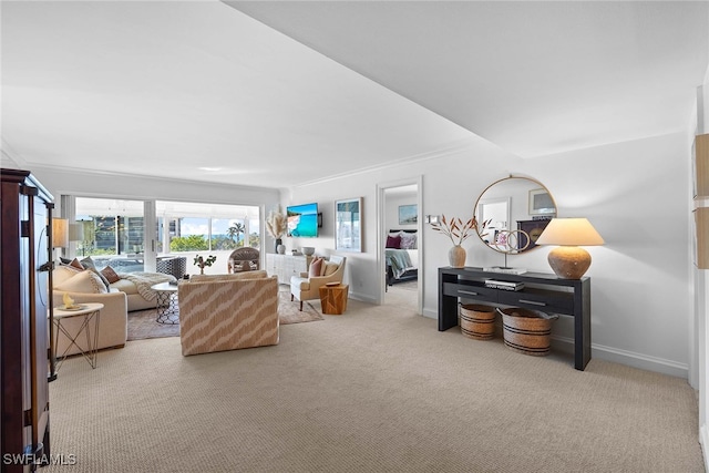 carpeted living room with crown molding