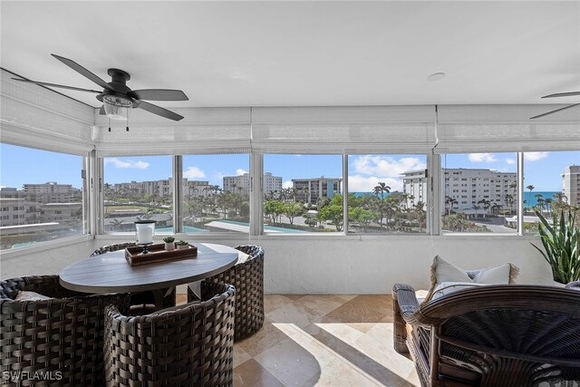 sunroom / solarium with ceiling fan