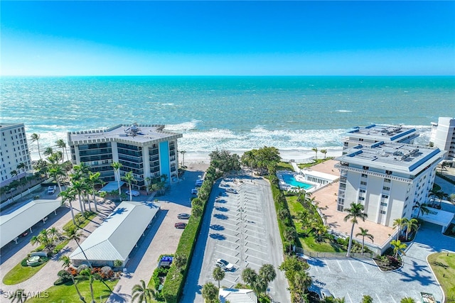 aerial view with a water view and a beach view