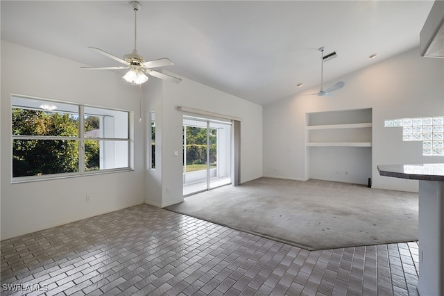 unfurnished living room featuring carpet flooring, ceiling fan, and vaulted ceiling