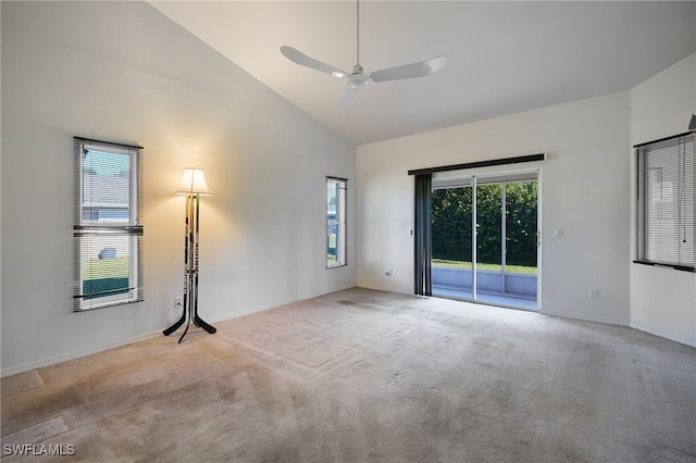 unfurnished room with ceiling fan, high vaulted ceiling, and light colored carpet