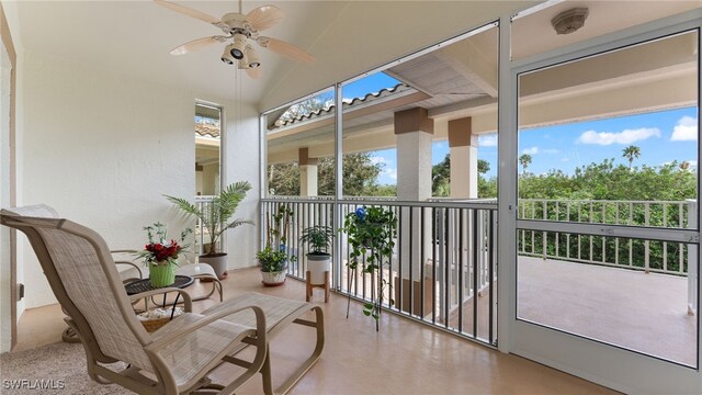 sunroom with a wealth of natural light and ceiling fan