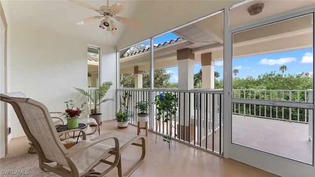 sunroom featuring vaulted ceiling and ceiling fan