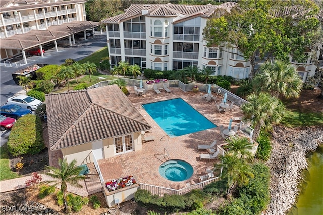 view of swimming pool featuring a water view