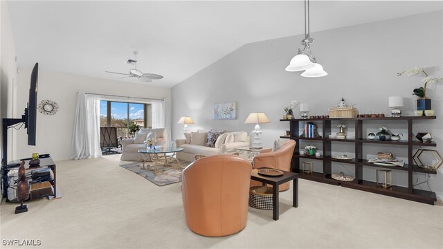 living room featuring ceiling fan, light carpet, and vaulted ceiling