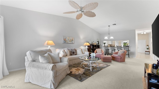 living room featuring ceiling fan with notable chandelier, light carpet, and high vaulted ceiling