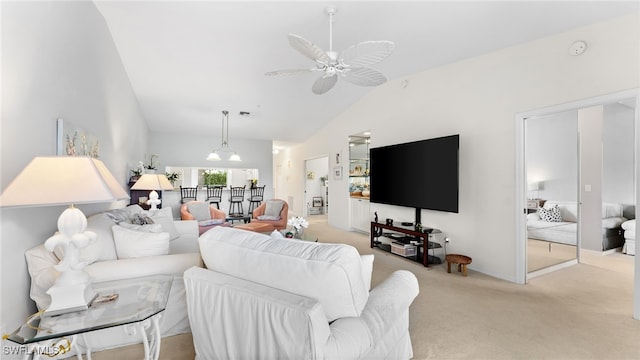 living room with ceiling fan, light colored carpet, and vaulted ceiling