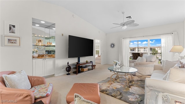 living room featuring vaulted ceiling, light carpet, and ceiling fan